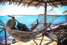 Va-I-Moana - Guest Relaxing on Hammock
Va I Moana Seaside Lodge