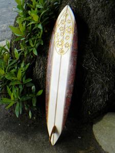 Carved granite surf board with gold leaf
A World of Stone