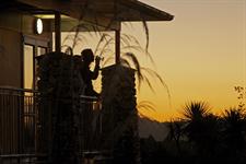 DH Fox Glacier - Wine on Balcony at Sunset
Distinction Fox Glacier Te Weheka Hotel